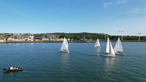 Beginner sailors practicing boat handling and navigation during the Learn to Sail course in Howth Sound with Quest Howth