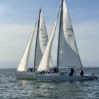 Beginner sailors practicing boat handling and navigation during the Learn to Sail course in Howth Sound with Quest Howth